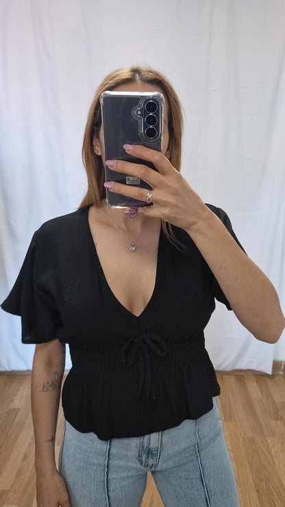 Blusa volante negra