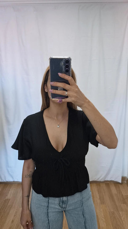 Blusa volante negra